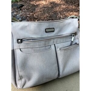 Baggallini large tan fabric bag w leather. Mult pockets. Leather trim, magnet
